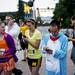 Mitsu Hammo dressed in a famous Japanese anime dog costume checks his phone before the Ann Arbor Marathon on Sunday, June 9. Daniel Brenner I AnnArbor.com